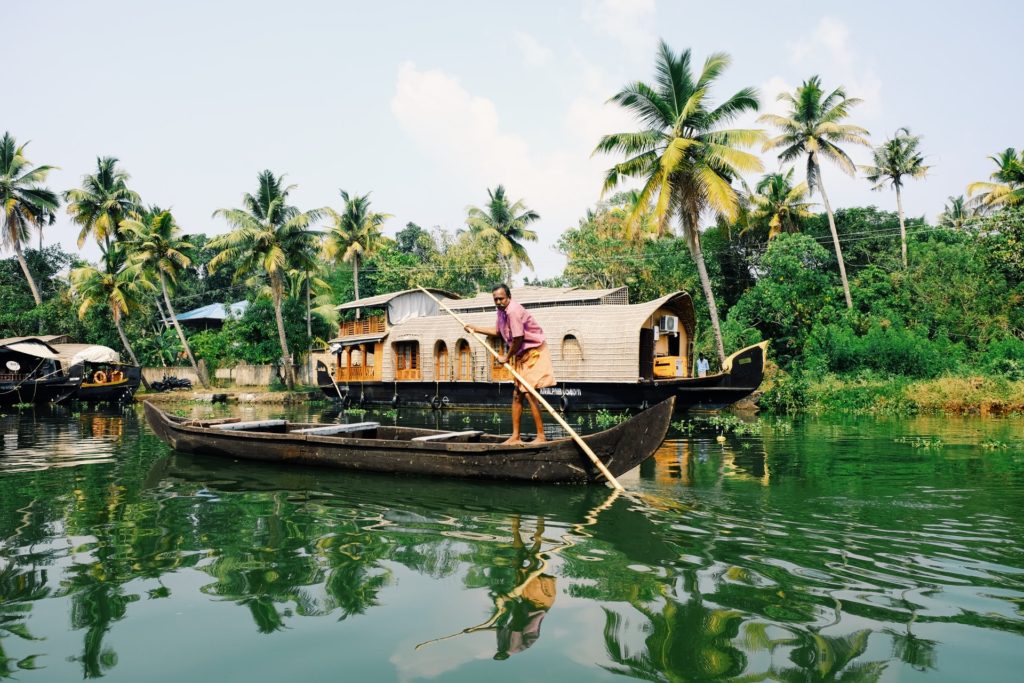 Best places to visit in India Number 4 - Boat at Kerela Backwaters.