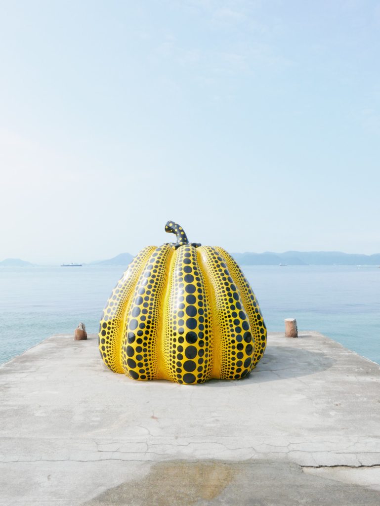 Places to include in your Japan itinerary Number 5 - Giant Pumpkin on Pier at Naoshima.