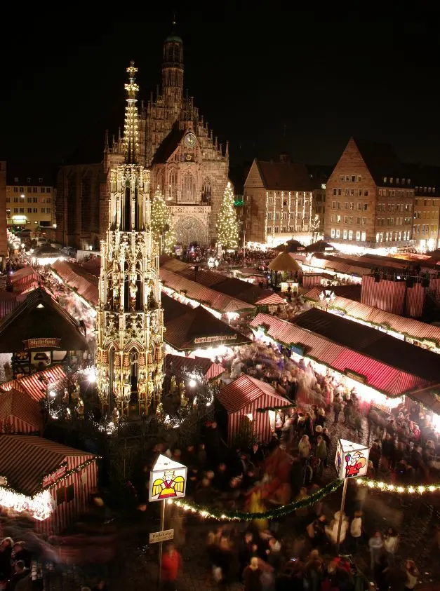 Places to include in your Germany itinerary Number 9 - Nuernberg Christmas Market at night.
